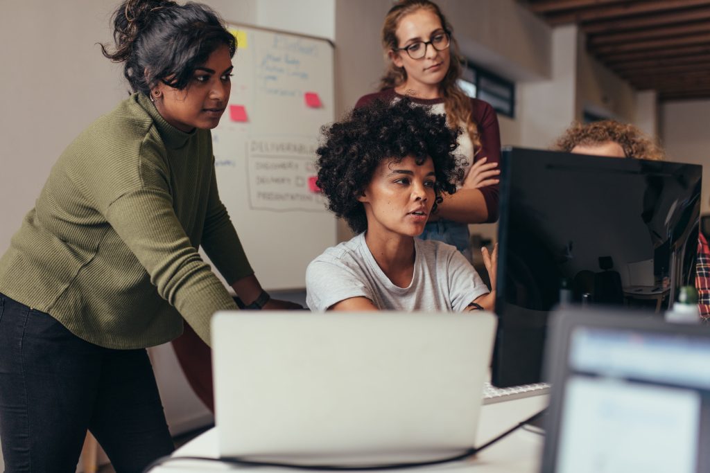 three people working